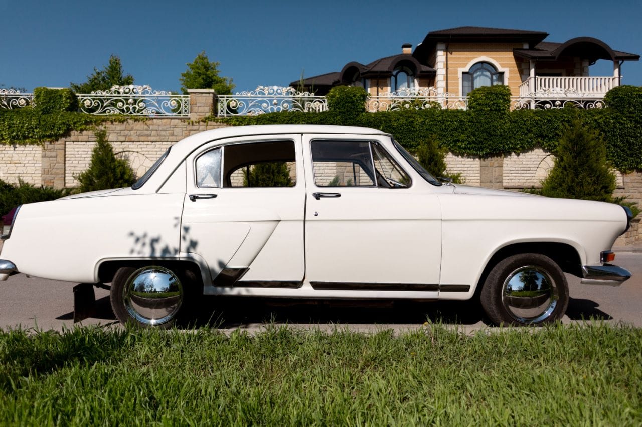 side view white old car